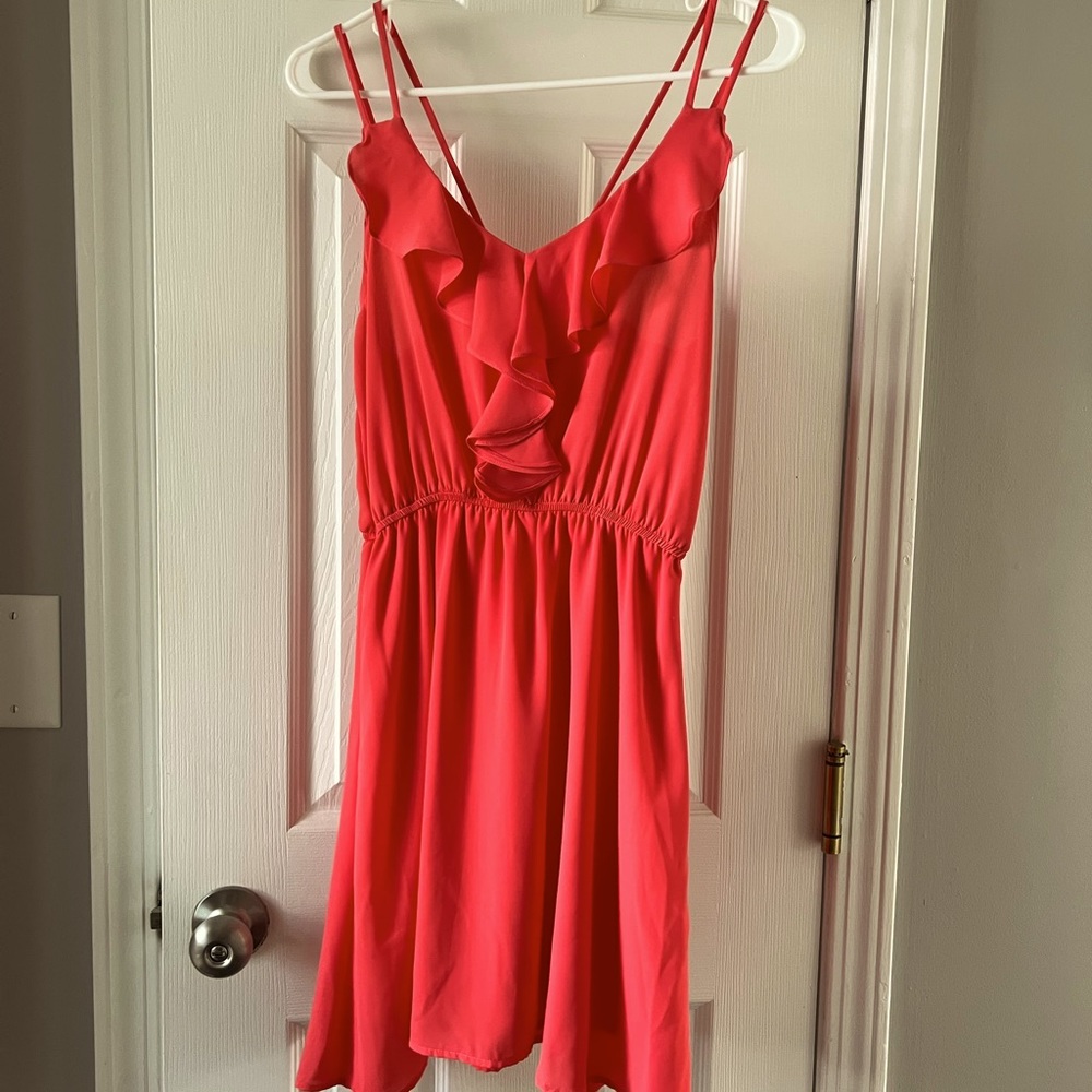 Bright coral ruffle front dress